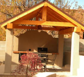Outdoor kitchen and shelter by Rising Sun Landscaping & Maintenance
