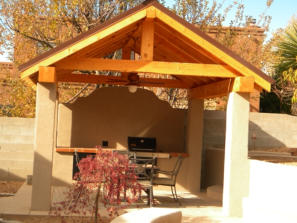 Outdoor kitchen with shelter and shade structure